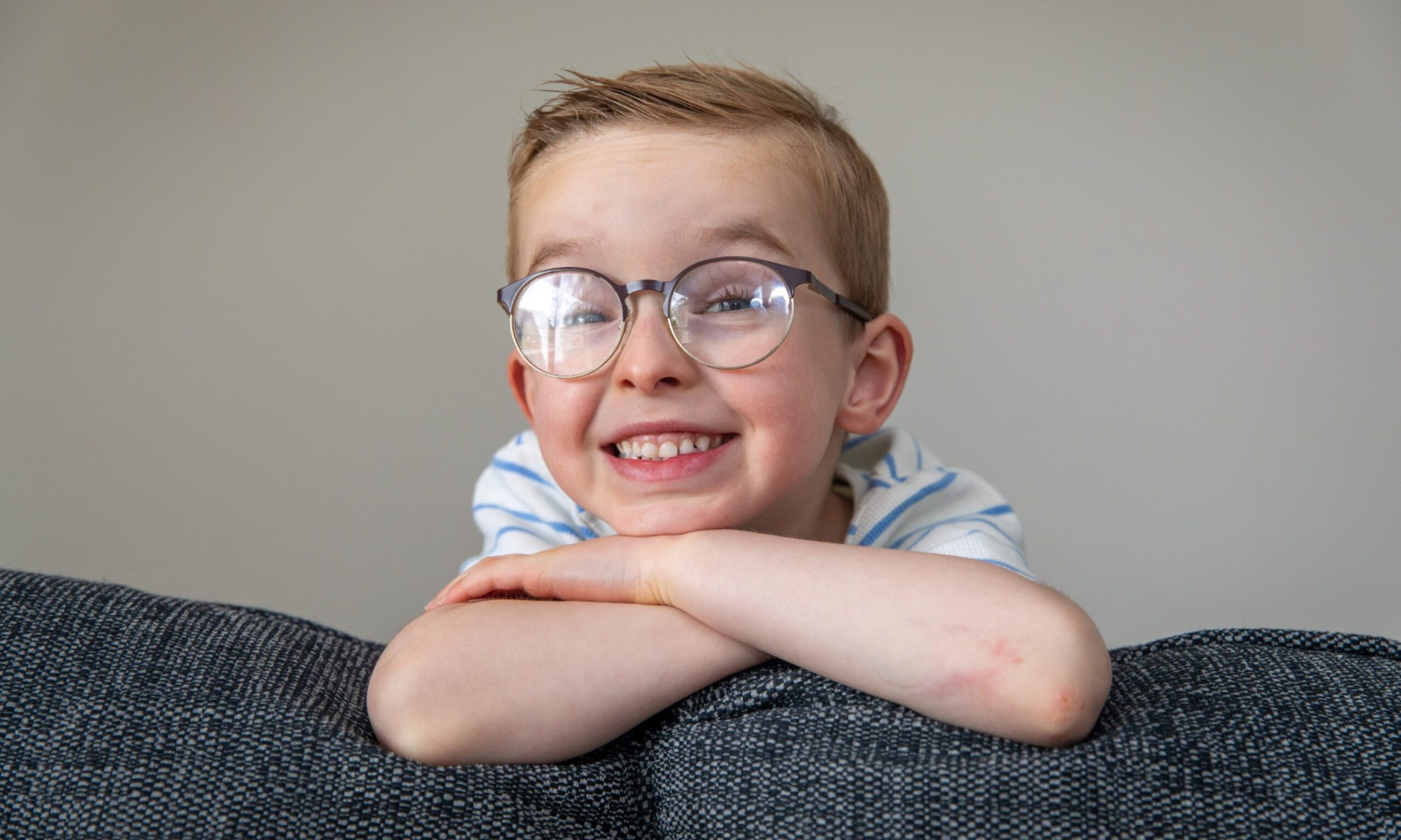 Thomas Sim is full of smiles despite the operations and casts he has had since he was a baby. Image: Steve Brown/DC Thomson.