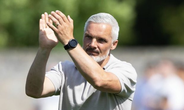Jim Goodwin salutes around 1,000 travelling fans at Glebe Park