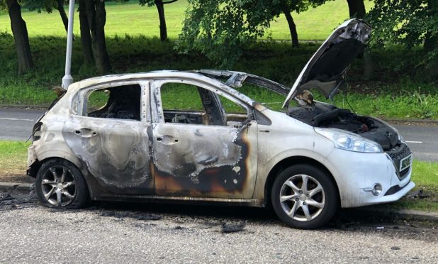 The car went on fire on South Road, Dundee. Image: James Simpson/DC Thomson
