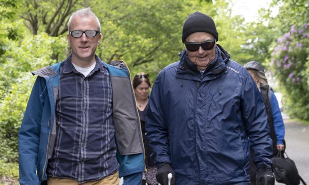 Courier journalist Michael Alexander (left) and visually impaired walker Ian Todd on a Seescape charity nature walk in Pittencrieff Park, Dunfermline.