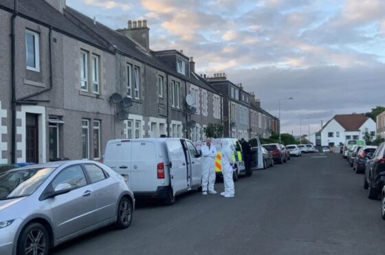 Police forensic officers at the scene on Taylor Street in Methil.