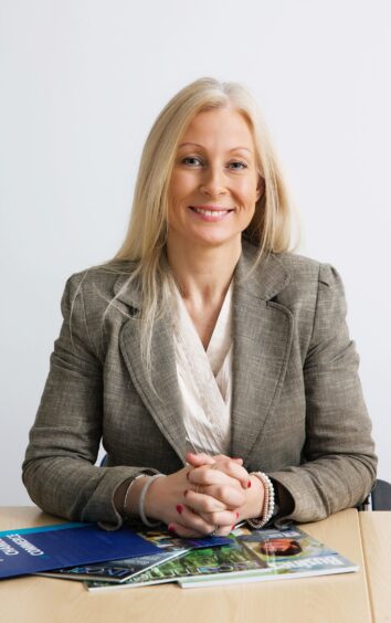 Vicki Unite, chief executive of Perthshire Chamber of Commerce, arms folded leaning on table