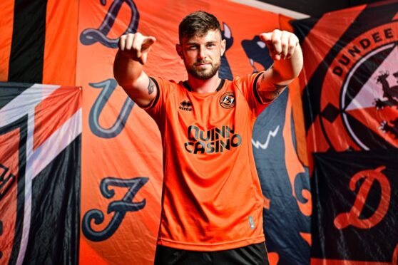 Summer signing WIll Ferry shows off Dundee United's new kit. Image: Dundee United FC
