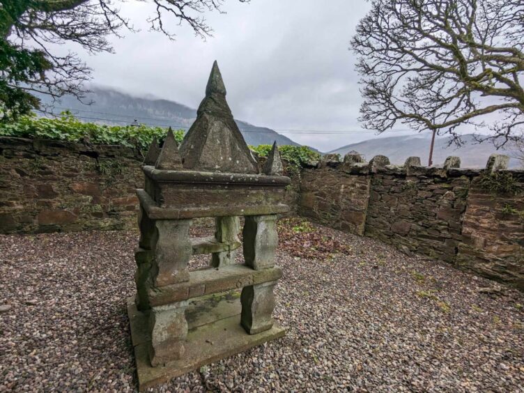 The belfry of the 18th Century church at Fortingall in an enclosure in the churchyard. Image: Gayle Ritchie.