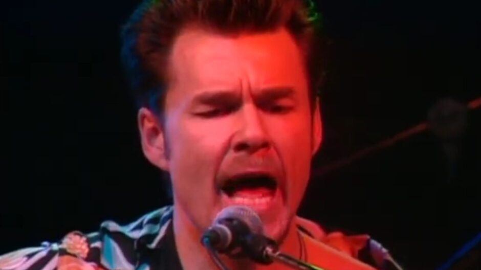 Stuart Adamson sings into the microphone