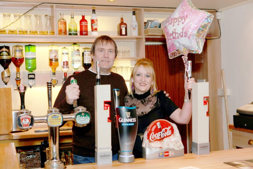 Fran and Grant Cunningham, pictured standing behind the bar, celebrate 20 years in business in 2011.