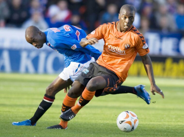 Morgaro Gomis in action for Dundee United against Rangers.