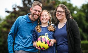 Grace Miller with dad Garry and mum Claire. Image: Mhairi Edwards/DC Thomson