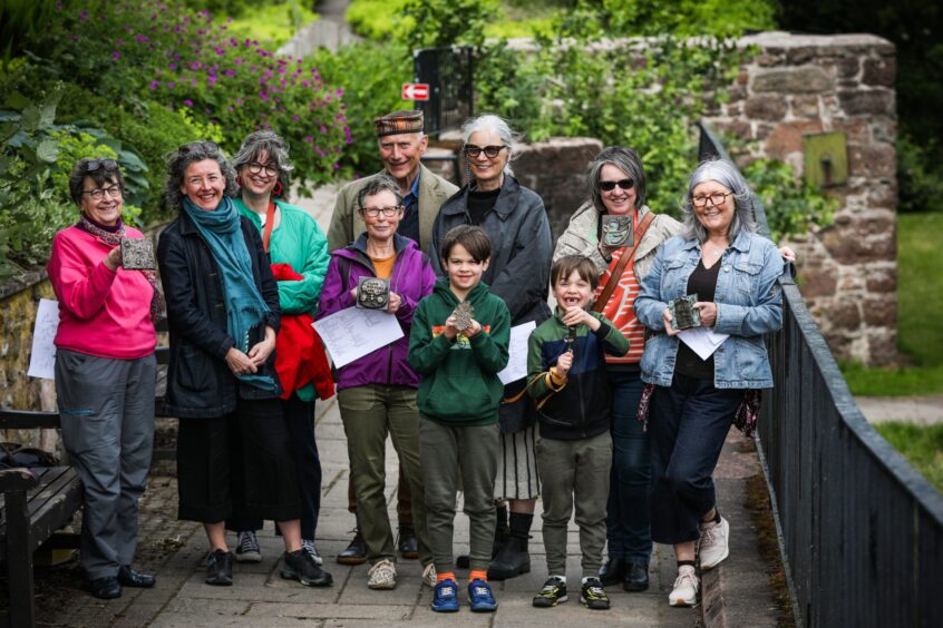 The artist Helen O'Brien with a group of locals in Blairgowrie