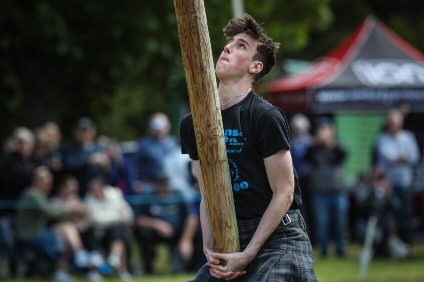 Tossing the caber at Strathmore Highland Games.