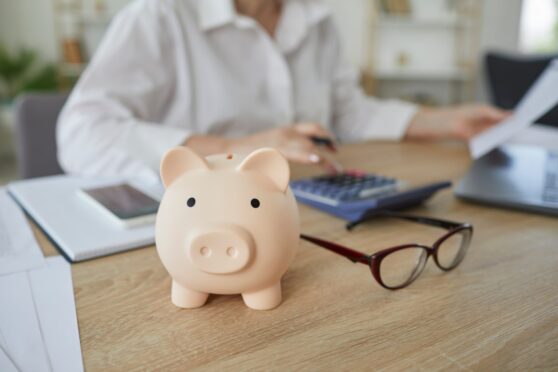 woman investor piggy bank