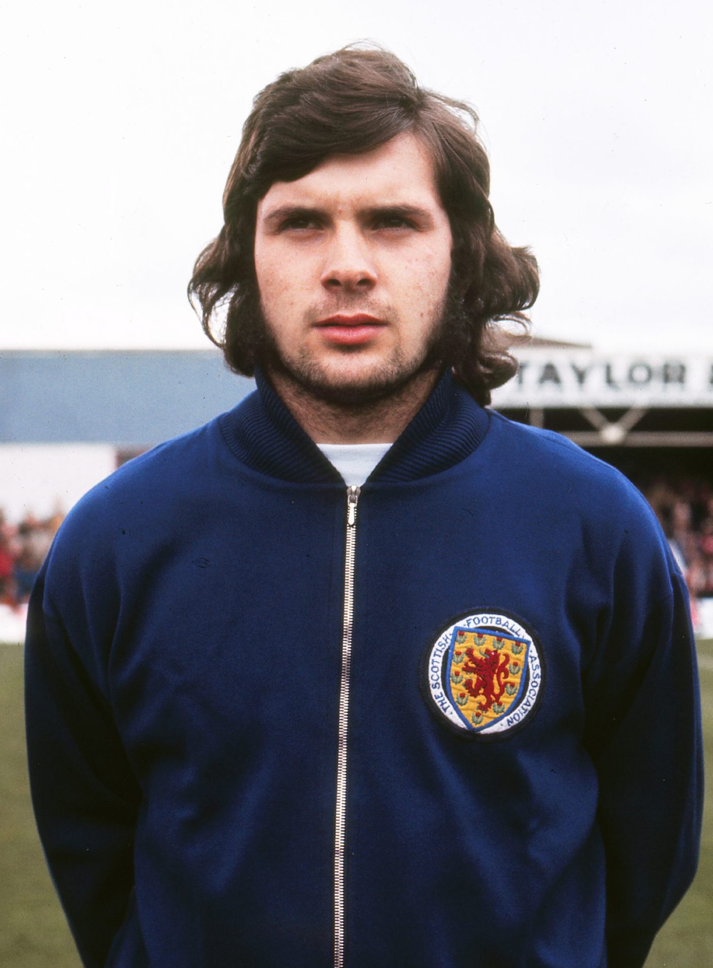 Derek Johnstone in his Scotland tracksuit before a game