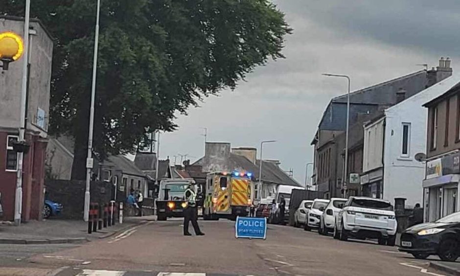 car flips Main Street, Thornton