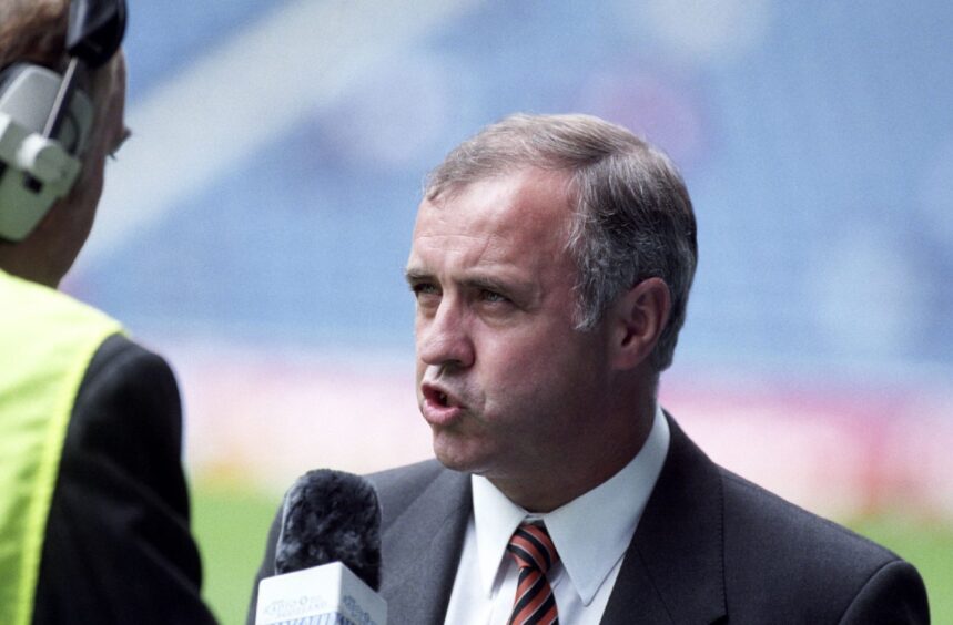 Dundee United boss Tommy McLean is interviewed by the side of the pitch