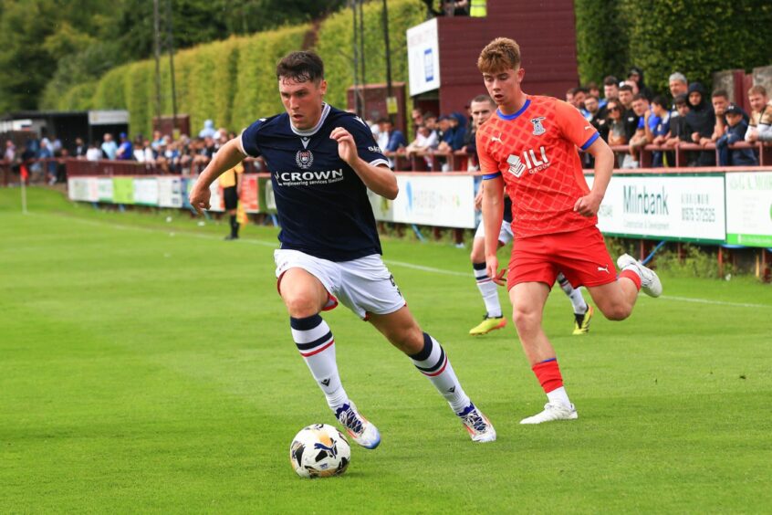 Josh Mulligan powers through the Inverness defence. Image: David Young/Shutterstock