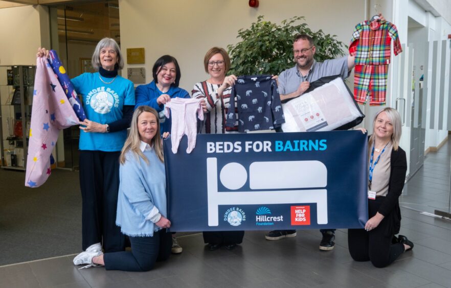 Image shows: a group of charity workers supporting the Beds for Bairns campaign in Dundee.