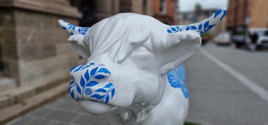 Close up of blue and white model cow's head outside Perth Museum