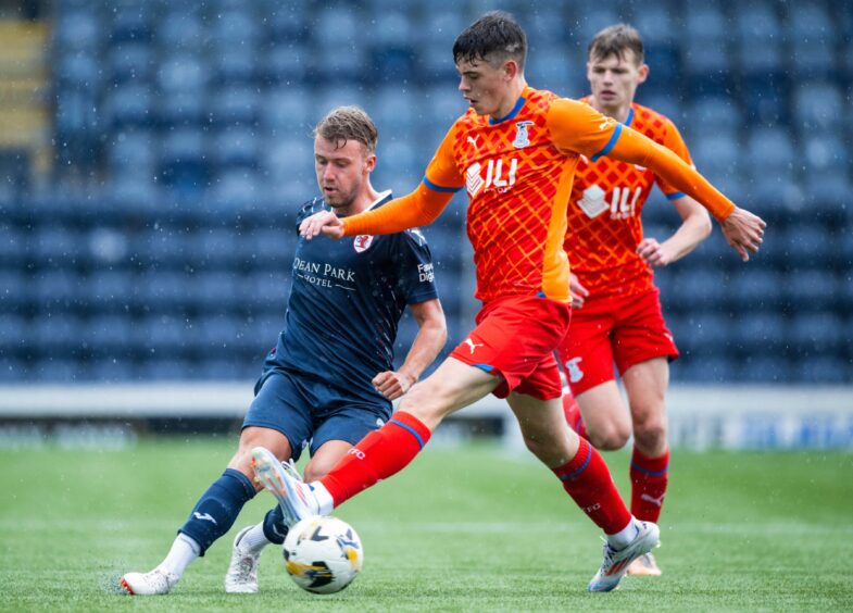 Kieran Freeman plays a pass for Raith Rovers.