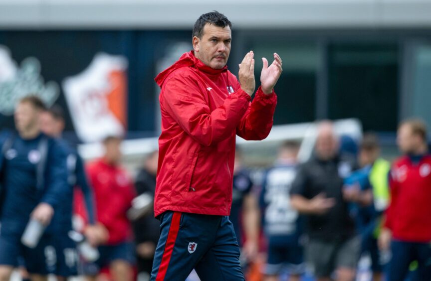 Manager Ian Murray claps the Raith Rovers supporters.