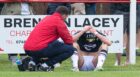 Charlie Reilly distraught on the sidelines after picking up another injury. Image: SNS