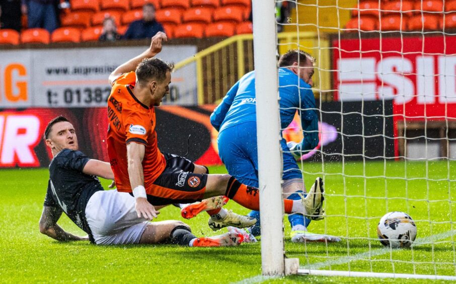 Kristijan Trapanovski bundles home his maiden goal the Tangerines.