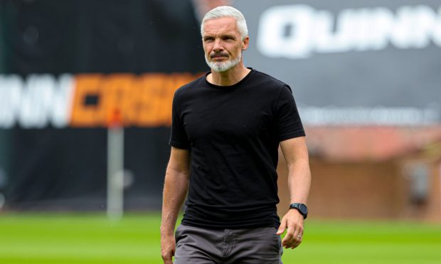 Jim Goodwin, pictured walking across the Tannadice pitch, has been heartened by the ability and mentality of Jort van der Sande