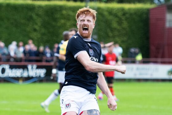 Simon Murray celebrates his first goal as a permanent Dundee player in victory over Annan. Image: SNS