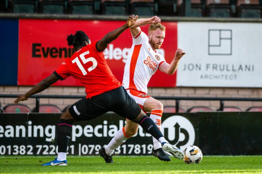 Jort van der Sande scrapping for possession for Dundee United