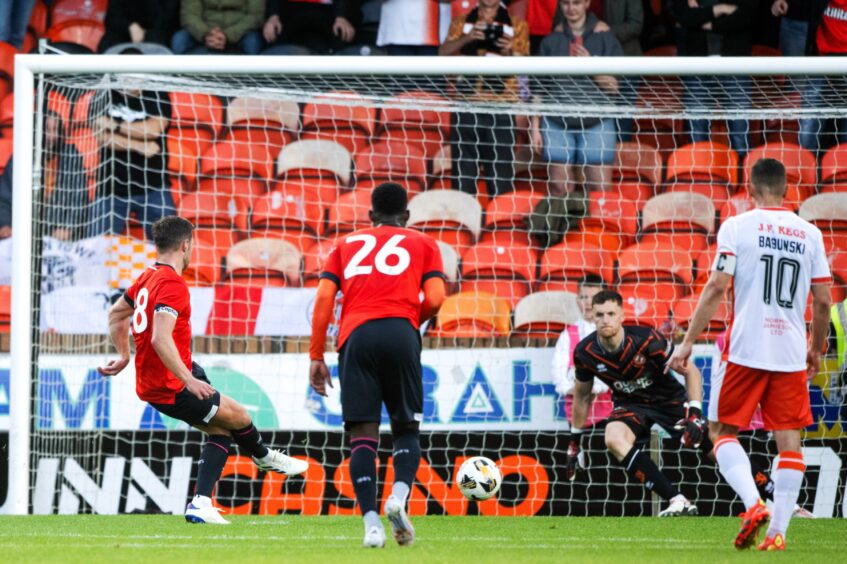 Luton Town's Jordan Clark makes no mistake from 12 yards