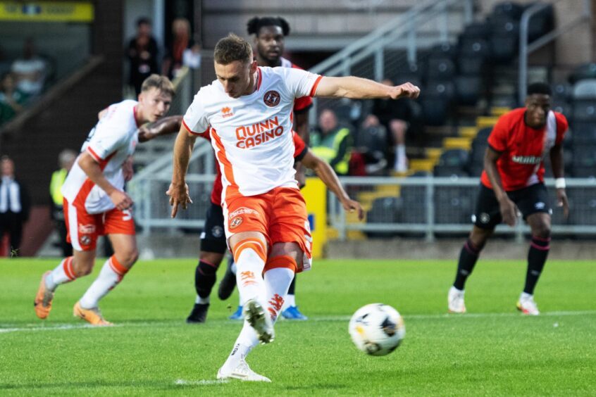 Dundee United's Louis Moult slammed home an unerring penalty against Luton