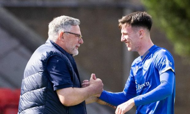 St Johnstone manager Craig Levein with Makenzie Kirk after the young striker scored his first goal in the last League Cup game.