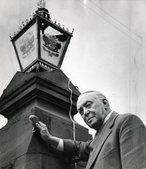 Sir Garnet Wilson holds the stone thrown through the light outside his home