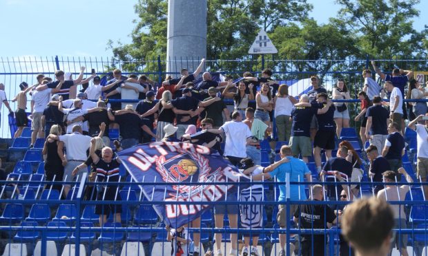 Dundee fans 'do the Poznan' as they see their favourites take on Lech Poznan. Image: David Young