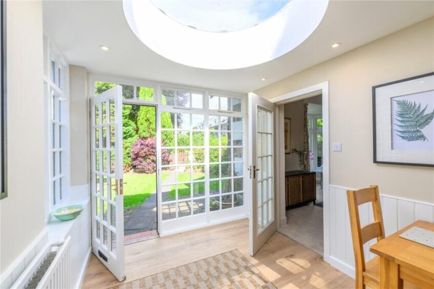 The entrance opens into the dining area in the St Andrews cottage. 