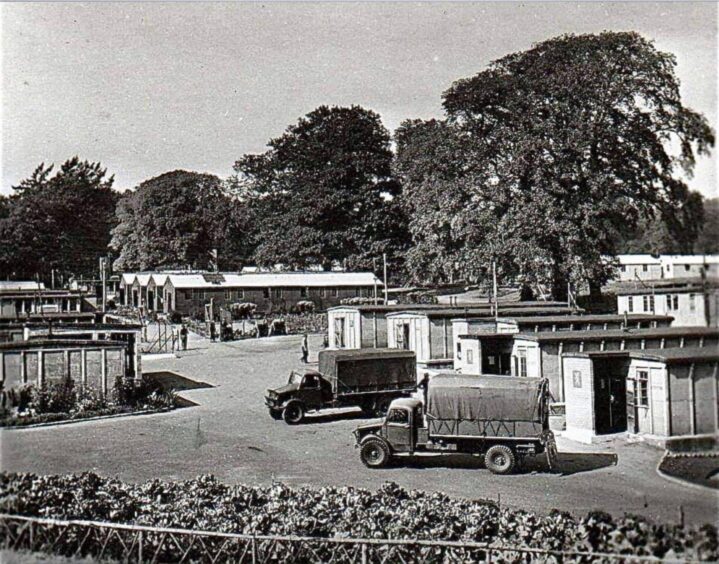 Image shows: A black and white photograph of Balhary prisoner of war camp, Alyth in the early 1940s.Berry pickers were housed in the huts during the summer months, including Dorothy Christie who stayed there in the summer of 1943.