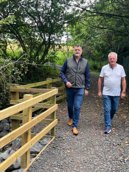 Athole McDonald and Craigie Hill golfer Paul Fagan walking on Buckie Braes path