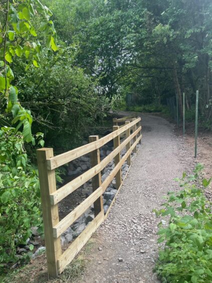 Restored path to Buckie Braes with solid timber fencing