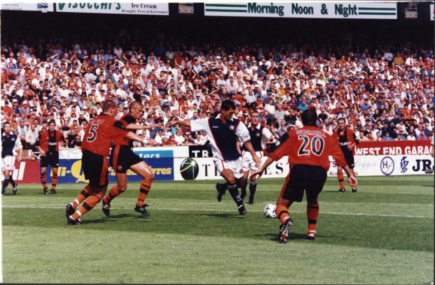 Dundee's WIllie Falconer curls home a super finish against Dundee United in 1999.