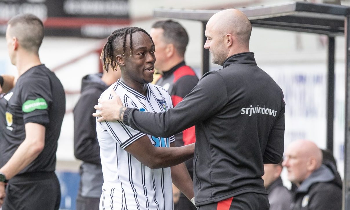 Ewan Otoo shakes hands with Dunfermline manager James McPake.