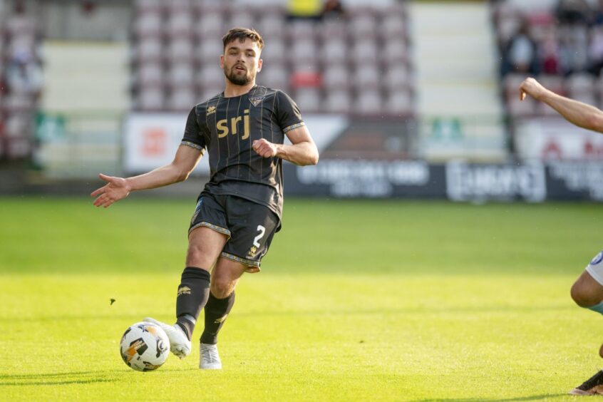 Dunfermline Athletic FC defender Aaron Comrie plays a pass.