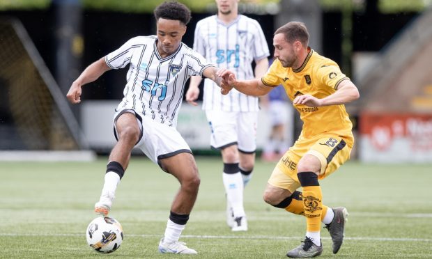 Dunfermline Athletic F.C. winger Kane Ritchie-Hosler (left) is confronted by Livingston opponent Scott Pittman.