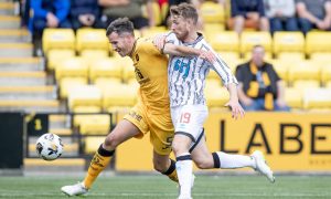 Livingston defender Ryan McGowan and Dunfermline midfielder David Wotherspoon tussle for the ball.