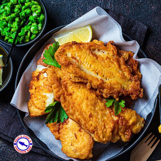 a plate of fried chicken with fish and chips 