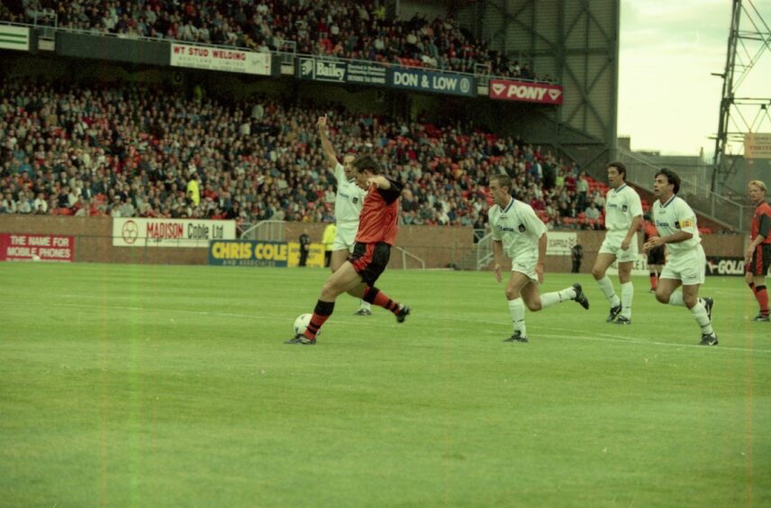 Dundee United forward Gary McSwegan opens the scoring from the penalty spot in 1997.