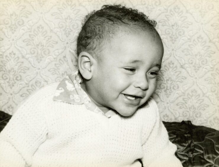 A smiling Daley Thompson when he was a baby. 