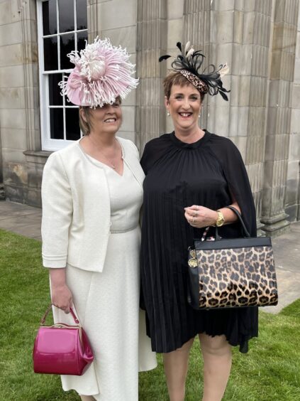 Dianne Stirrat and Linda Fisken in formal dresses with nice hats