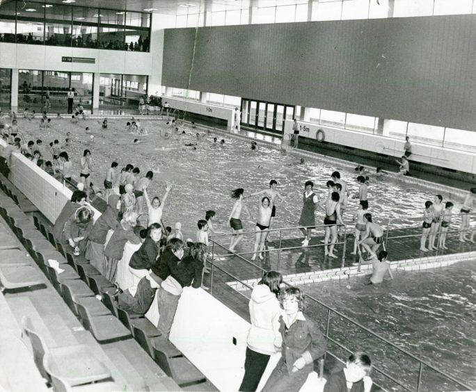 A group of children splashing in the water at the old Olympia