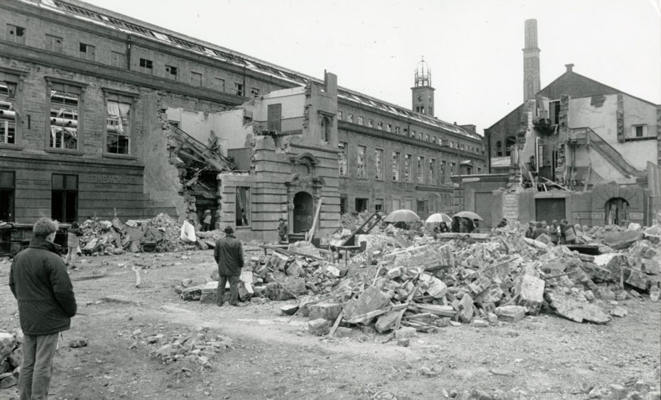 Camperdown Works was the setting for filming Christabel in 1988. Two men look out a rubble-strewn courtyard