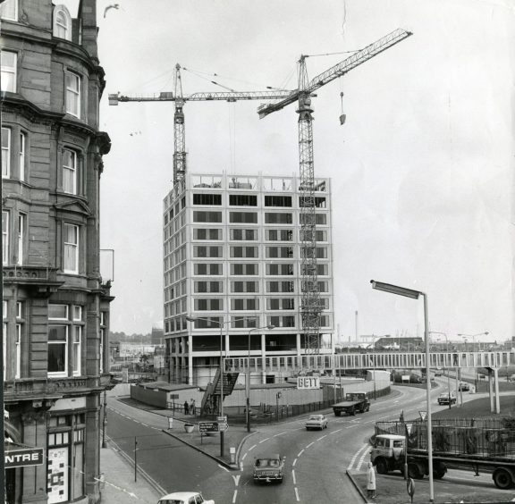 Tayside House taking shape in August 1974, with two cranes atop the Dundee structure