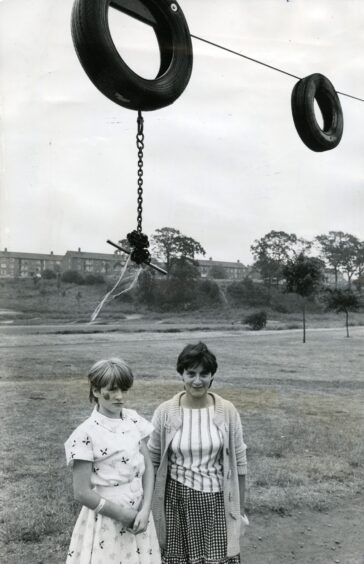 Edith and Sharon Keogh standing underneath the swing at Finlathen Park.